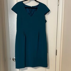 Fitted dark teal dress.
